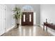 Welcoming foyer with a dark wood front door, tiled floors, and neutral paint at 3670 River Mansion Dr, Peachtree Corners, GA 30096