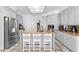 Bright kitchen featuring an island with seating, stainless steel appliances, and ample cabinet space at 3670 River Mansion Dr, Peachtree Corners, GA 30096