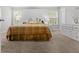 Spacious bedroom with neutral carpet, large windows, and a dresser with a unique mirror for a bright, airy feel at 236 Rankin Cir, Mcdonough, GA 30253