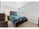 Cozy bedroom with neutral carpet, ample natural light, and a comfortable queen-sized bed at 236 Rankin Cir, Mcdonough, GA 30253