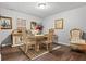 Cozy dining area with hardwood floors, elegant furniture, and decorative accents at 236 Rankin Cir, Mcdonough, GA 30253