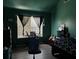 Bedroom with green walls, hardwood floors, blinds and black out curtains at 3429 Lake End Dr, Loganville, GA 30052