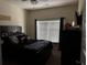 Bedroom with a bed, window, and a TV on a dresser at 3429 Lake End Dr, Loganville, GA 30052