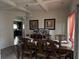 Elegant dining room with coffered ceiling, chandelier, and ample seating for Gathering gatherings at 3429 Lake End Dr, Loganville, GA 30052