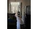 Bright entryway with arched doorways, hardwood floors, and natural light streaming through the front door at 3429 Lake End Dr, Loganville, GA 30052