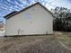 Exterior view of home showing siding, small window, and yard with green grass at 3429 Lake End Dr, Loganville, GA 30052