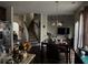 Open floor plan featuring the kitchen, dining area, and living area with view of the staircase at 3429 Lake End Dr, Loganville, GA 30052