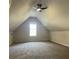 Upstairs bonus room area featuring carpeted floors and neutral walls at 3920 Knots Pass Rd, Snellville, GA 30039