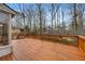 Spacious wooden deck with glass windows, showcasing an outdoor entertaining space at 2667 Stonebrook Ne Ct, Roswell, GA 30075