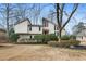 Charming two-story home with a landscaped yard and interesting architectural details at 2667 Stonebrook Ne Ct, Roswell, GA 30075