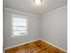 Quaint bedroom with hardwood floors and a bright window at 2895 Akron St, Atlanta, GA 30344