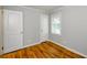 Bedroom with hardwood floors, closet, and a view from the window at 2895 Akron St, Atlanta, GA 30344