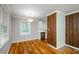 Cozy dining area with refinished hardwood floors and views of the updated kitchen at 2895 Akron St, Atlanta, GA 30344