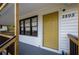 Close up of the front entrance featuring a yellow painted door, house numbers, and freshly painted trim at 2895 Akron St, Atlanta, GA 30344