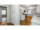 Bright kitchen with stainless steel appliances, white cabinets, and stylish tile floors at 2895 Akron St, Atlanta, GA 30344