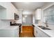 Modern kitchen with stainless steel appliances, bright white cabinets, and sleek countertops at 2895 Akron St, Atlanta, GA 30344
