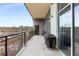 Spacious balcony with sleek black railings, perfect for outdoor relaxation and entertaining, featuring a grill and bicycles at 3400 Malone Dr # 303, Atlanta, GA 30341