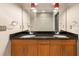 Bathroom with double sinks, granite countertop, and a view of the shower at 3400 Malone Dr # 303, Atlanta, GA 30341