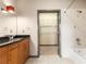 Bathroom featuring a tub-shower combo, and a glimpse into the walk-in closet at 3400 Malone Dr # 303, Atlanta, GA 30341