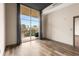 Bedroom features a large window with curtains and balcony access, complemented by stylish and neutral decor at 3400 Malone Dr # 303, Atlanta, GA 30341