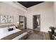 Bedroom showcasing a bed, stylish decor, and convenient access to the en-suite bathroom and walk-in closet at 3400 Malone Dr # 303, Atlanta, GA 30341