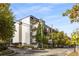 Contemporary building with multiple balconies, offering views of the surrounding leafy neighborhood at 3400 Malone Dr # 303, Atlanta, GA 30341