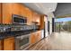 Updated kitchen showcasing stainless steel appliances, granite countertops, and mosaic backsplash at 3400 Malone Dr # 303, Atlanta, GA 30341