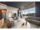 Open concept living space with modern furnishings, hardwood floors, and floor-to-ceiling windows at 3400 Malone Dr # 303, Atlanta, GA 30341