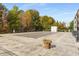 Pool area, covered for the off-season, with a large deck and lush trees providing privacy at 3400 Malone Dr # 303, Atlanta, GA 30341