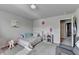 Bright bedroom featuring neutral walls, gray carpet, and a bed at 3488 In Bloom Way, Auburn, GA 30011