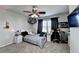 Bedroom includes gray walls, neutral carpet, desk area, and ceiling fan at 3488 In Bloom Way, Auburn, GA 30011