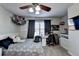 Bedroom includes gray walls, neutral carpet, desk area, and ceiling fan at 3488 In Bloom Way, Auburn, GA 30011