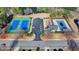 This aerial shot highlights the community's recreational amenities, including tennis courts, pool, and playground at 3488 In Bloom Way, Auburn, GA 30011