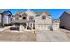 Traditional two-story brick home with attached two-car garage and well-manicured lawn at 3488 In Bloom Way, Auburn, GA 30011