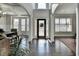Bright foyer with hardwood floors, decorative columns, and ample natural light at 3488 In Bloom Way, Auburn, GA 30011