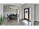 Elegant foyer showcasing hardwood floors, decorative columns, and a view to the dining room at 3488 In Bloom Way, Auburn, GA 30011
