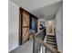 Upstairs hallway features a sliding barn door and iron railing at 3488 In Bloom Way, Auburn, GA 30011