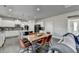 Spacious kitchen with white cabinets, stainless steel appliances, and island with seating at 3488 In Bloom Way, Auburn, GA 30011
