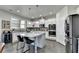 Gourmet kitchen featuring granite countertops, white cabinetry, and stainless steel appliances at 3488 In Bloom Way, Auburn, GA 30011