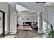 Open concept living room featuring an archway, hardwood floors, and stylish decor at 3488 In Bloom Way, Auburn, GA 30011