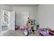 Spacious playroom area next to a staircase at 3488 In Bloom Way, Auburn, GA 30011