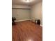 Basement with hardwood floors, a table, and a chair at 911 Laurel Crest Dr, Woodstock, GA 30189