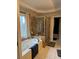 A bathroom featuring a shower, a bathtub, and a window that allows natural light at 911 Laurel Crest Dr, Woodstock, GA 30189