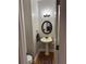 Charming powder room with pedestal sink, mirror, and attractive lighting at 911 Laurel Crest Dr, Woodstock, GA 30189