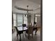 Elegant dining room with tray ceilings and a large window overlooking the yard at 911 Laurel Crest Dr, Woodstock, GA 30189