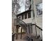 Two-story house featuring a gray staircase and a beige exterior siding at 911 Laurel Crest Dr, Woodstock, GA 30189