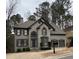 Charming two-story home with a well-maintained yard and two-car garage at 911 Laurel Crest Dr, Woodstock, GA 30189