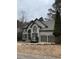 Charming two-story home with a well-maintained yard and two-car garage at 911 Laurel Crest Dr, Woodstock, GA 30189