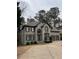 Charming two-story home with a well-maintained yard and two-car garage at 911 Laurel Crest Dr, Woodstock, GA 30189