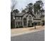 Charming two-story home with a well-maintained yard and two-car garage at 911 Laurel Crest Dr, Woodstock, GA 30189